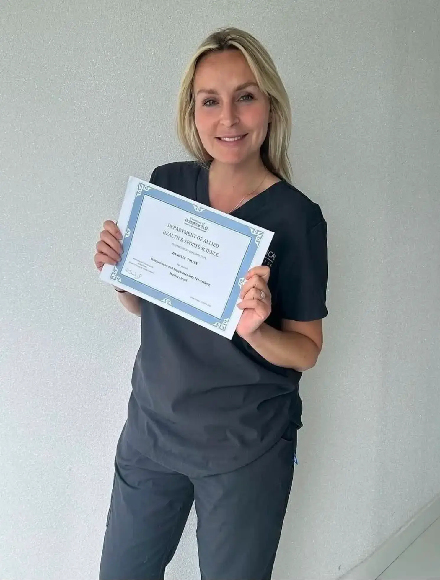 Nurse Danielle holding an Independent and Supplementary Prescribing qualification certificate