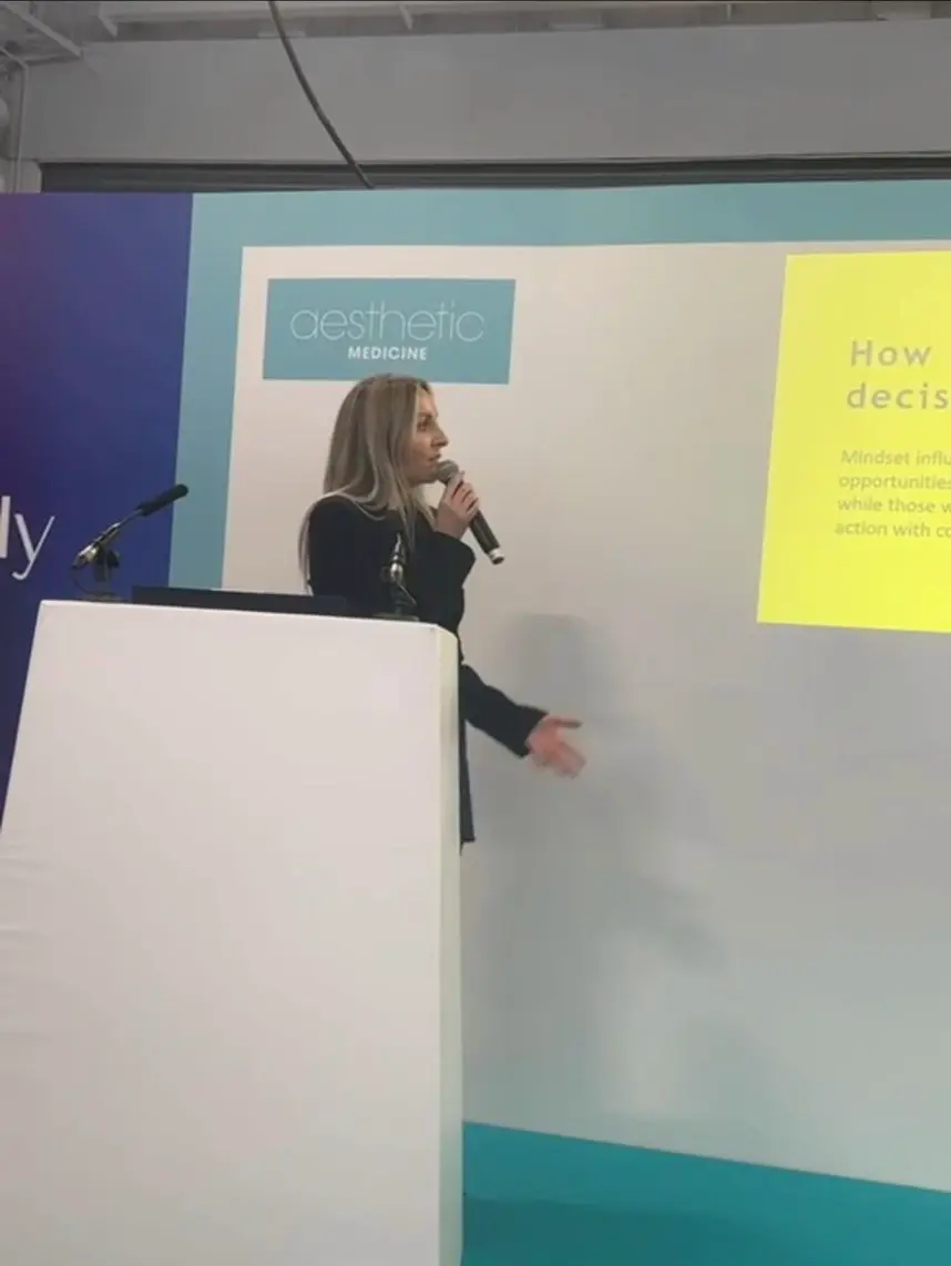 Nurse Danielle speaking at an aesthetics event